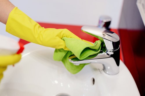 Professional oven cleaner in Shepherdsbush deep cleaning a greasy oven interior