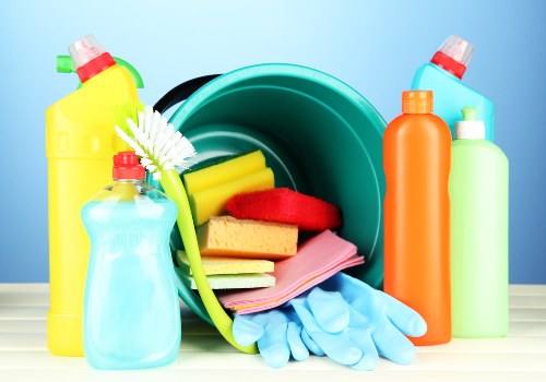 Technician using professional carpet cleaning equipment with protective gear